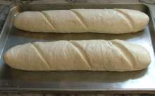 picture of formed French loaves 
ready to bake